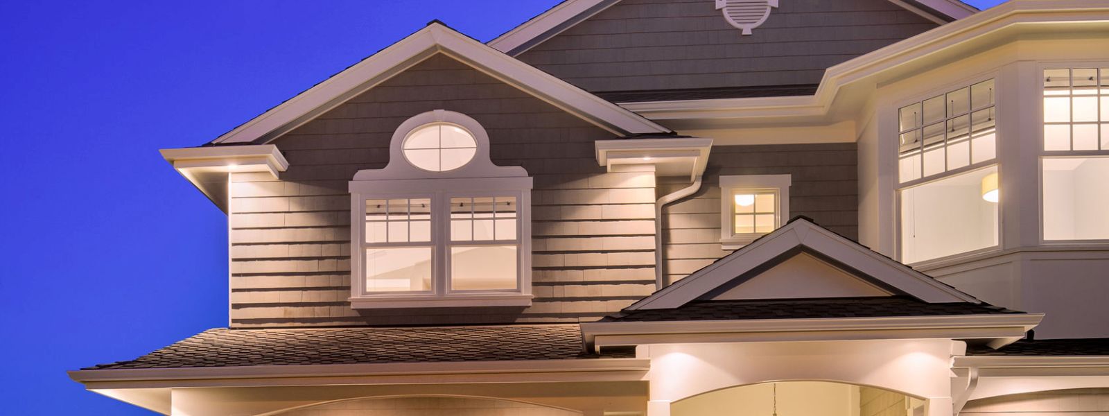 Siding exterior remodeling image of a house with beige hardie board siding.